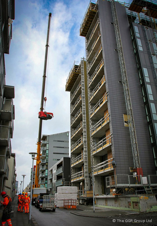 UNIC URW-295 being lifted onto high rise building in Reykjavik