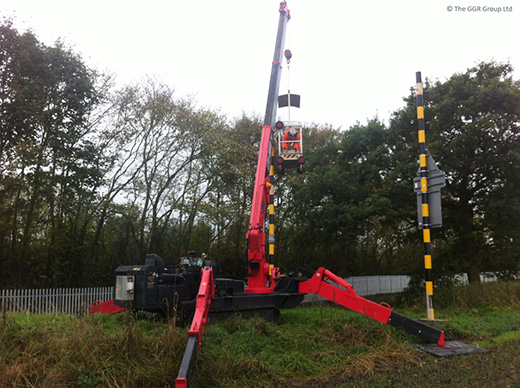 UNIC URW-506 mini crane at railway crossing