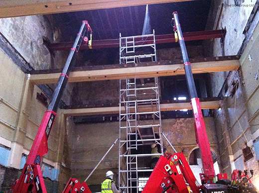 Pair of UNIC mini cranes installing steelwork