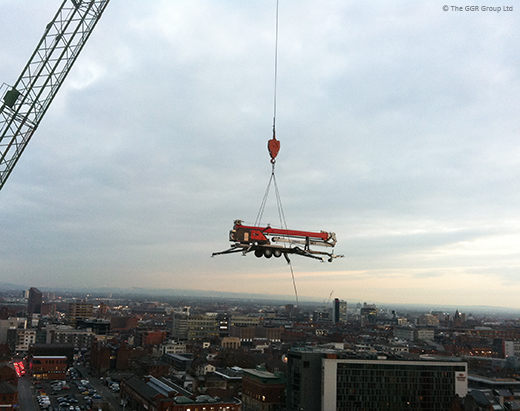 Starworker trailer crane being lifted by a tower crane