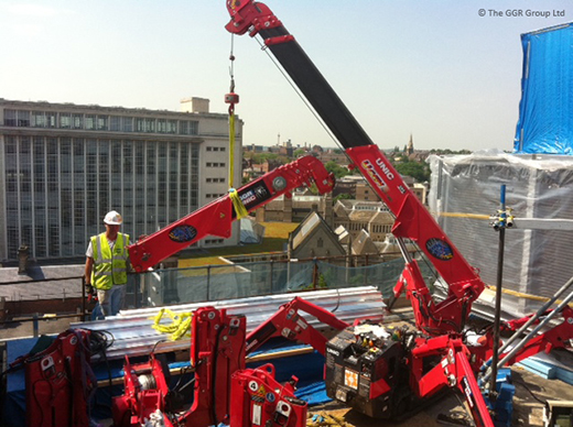 UNIC mini crane dismantled and rebuilt on rooftop