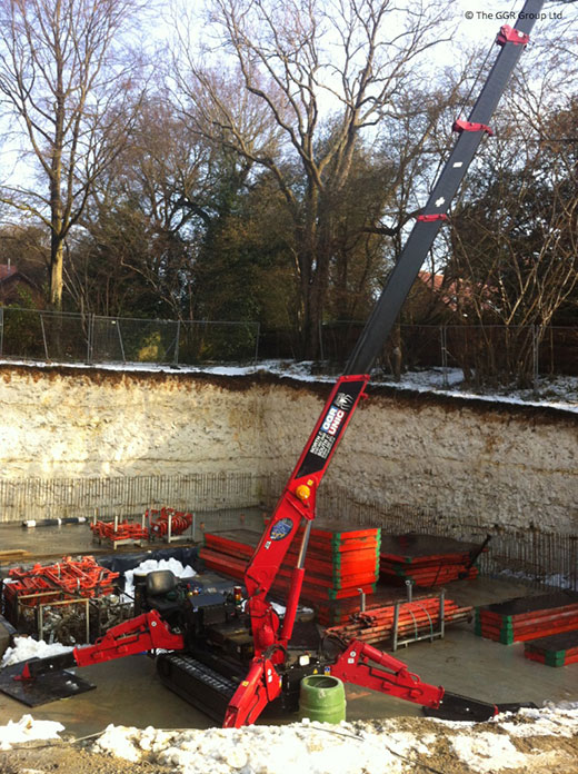UNIC crane installing formwork for new build home