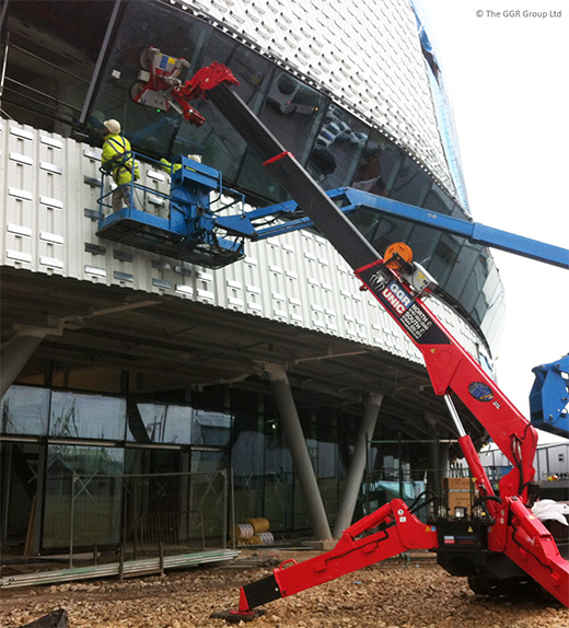 UNIC mini spider crane installs glazing at Derby velodrome