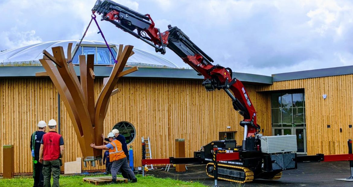 TMC 525 Articulated Crawler Crane lifting a metal tree at a Yorkshire park.