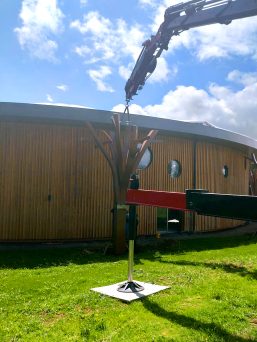 TMC 525 Articulated Crawler Crane lifting a metal tree at a Yorkshire park.