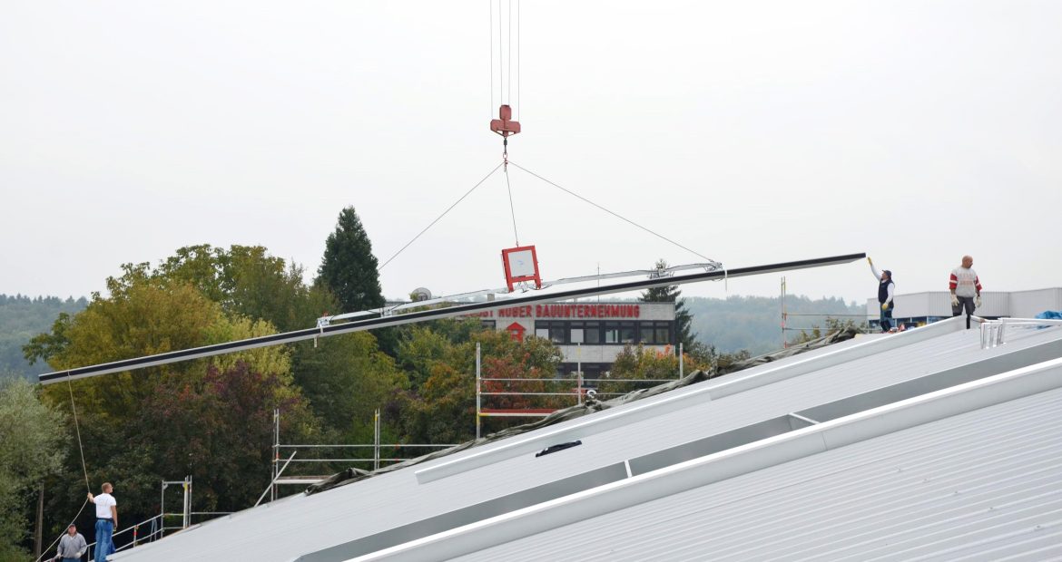 GGR Group's Clad-Man installing roof panels.