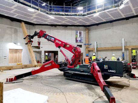 MultiGrab on a UNIC URW-706-2 Mini Spider Crane installing timber beams for a theatre.