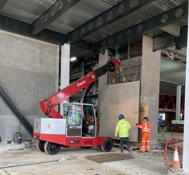 A G120 Pick and Carry Crane lifting pre-cast concrete.