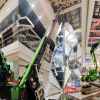 TMC 25 Articulated Crawler Crane lifting a Christmas tree inside a shopping centre.