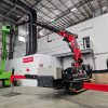 TMC 525 Articulated Crawler Crane and Mini-Clad lifting cladding inside a warehouse for a well-known British meal kit retailer.