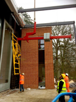 A Libro 5000 Overhang Beam and Hydraulica 4000 Glass Vacuum Lifter working together to lift oversized glazing.