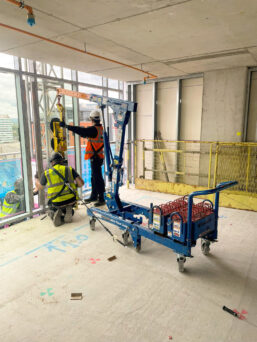 The MFC 750 Floor Crane lifting glazing for inside out glazing.